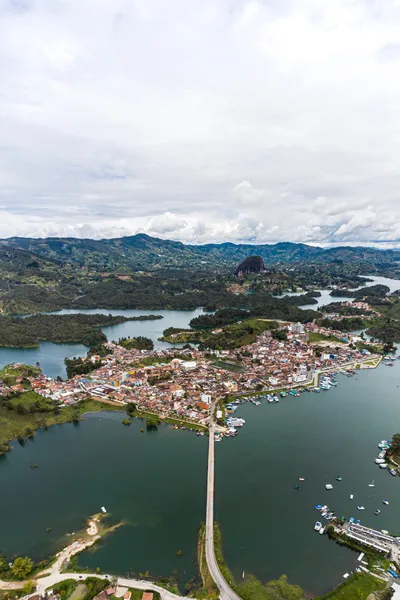 Excursion to Guatapé from Medellín by Chiva with Lunch, Lake Cruise, and Visit to Pablo Escobar's Hacienda