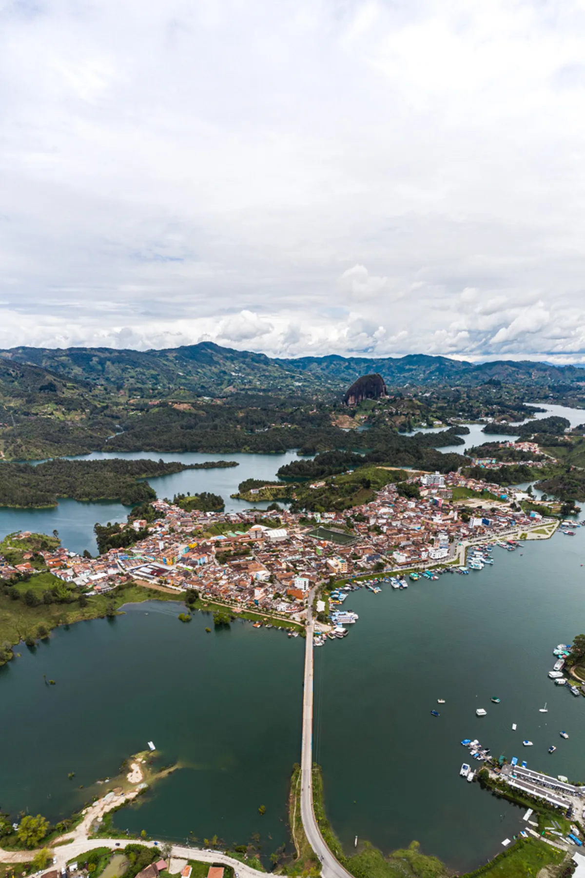 Excursion to Guatapé from Medellín by Chiva with Lunch, Lake Cruise, and Visit to Pablo Escobar's Hacienda