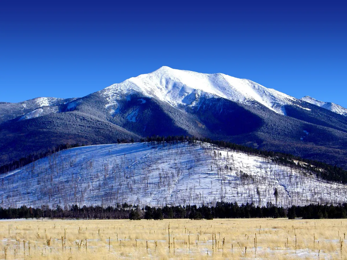 Grand Canyon Complete Day Tour from Sedona or Flagstaff with Lava Fields, Native Ruins & Painted Desert Views