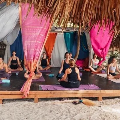 Sunrise yoga class overlooking the beach, the sea & sunrise .